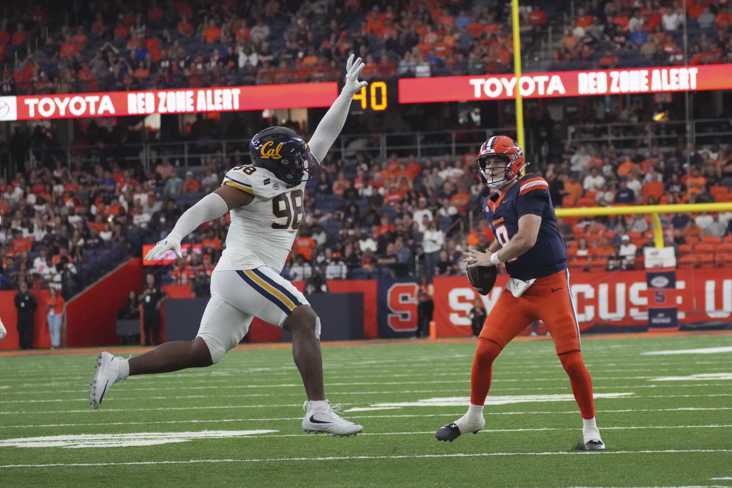 Quarterback Stevi Angeli escaping Golden Bears defender Nate Burrell to the sideline searching for an open receiver against the California Golden Bears on Sept. 12, 2026 in the JMA Wireless Dome.