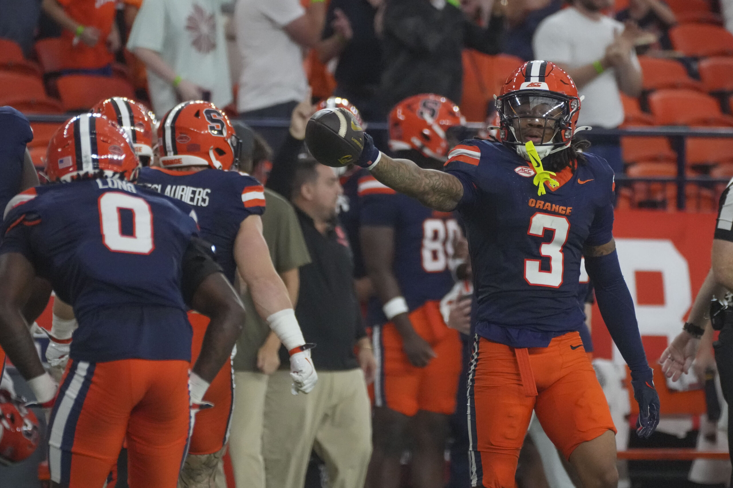 Punt returner Davien Kerr celebrating after a 27 yard return, putting the Orange in good field position to start the drive.