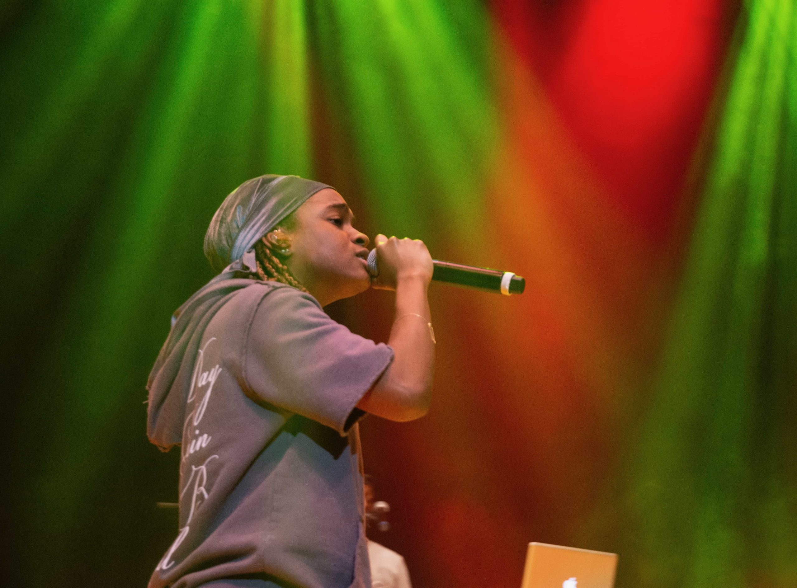 Koffee energizes the crowd under the warm stage lights