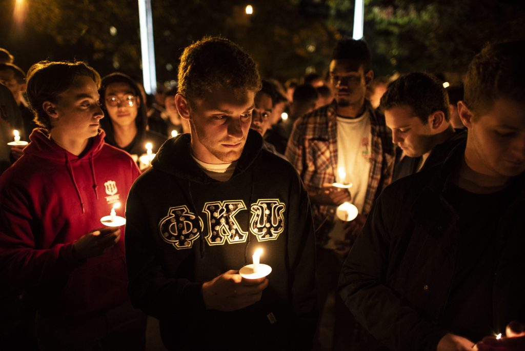 Members of the Phi Kappa Psi Fraternity hold candles at the Safe Driving Vigil sponsored by both Phi Kappa Psi and Delta Delta Delta Monday evening outside Hendricks Chapel.
