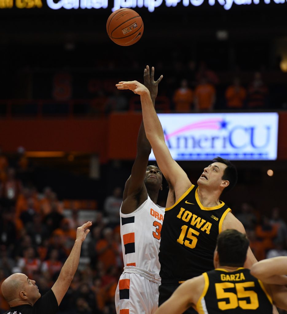 SU’s Bourama Sidibe and Iowa’s Ryan Kriener jump for the opening tipoff during the ACC/Big Ten Challenge at the Carrier Dome on December 3, 2019.