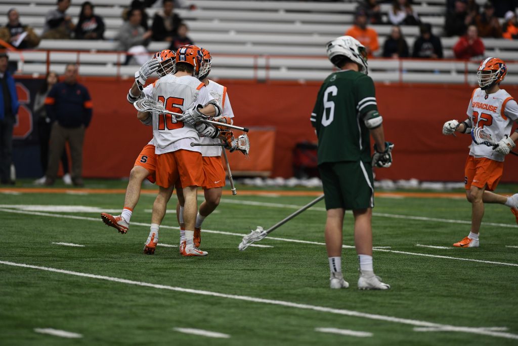 Syracuse players celebrate after scoring.