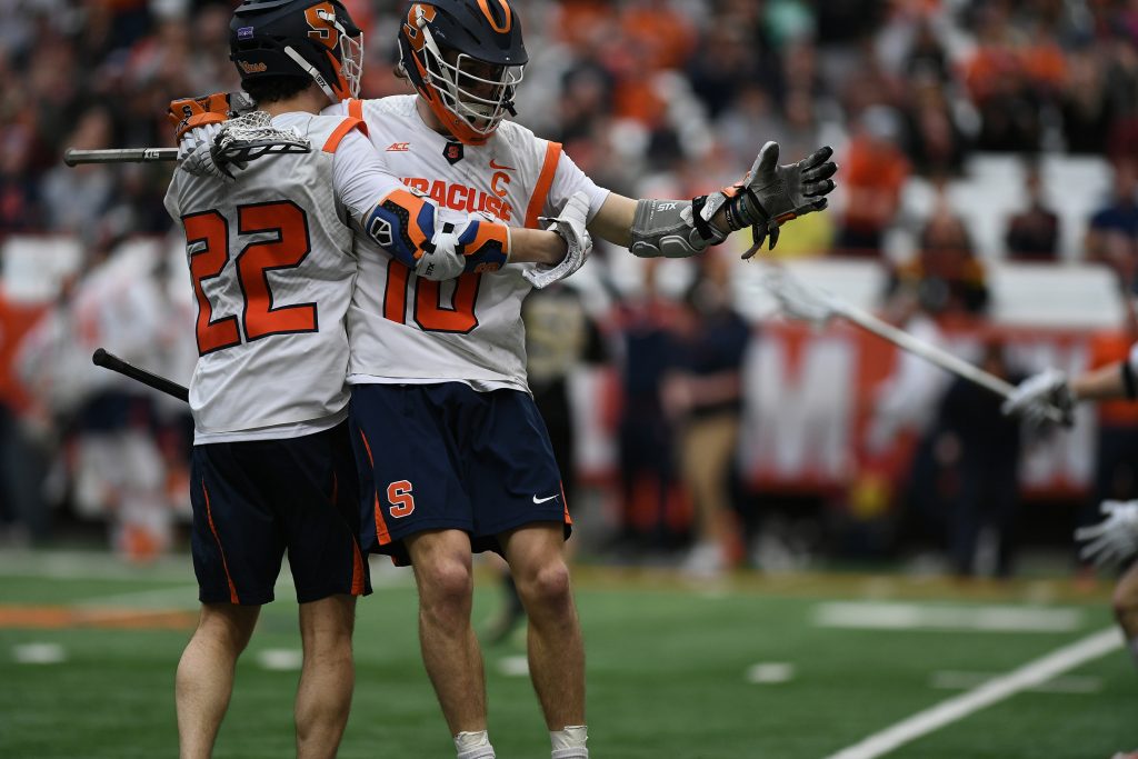 Brendan Curry and Chase Scanlan celebrate after Curry’s goal late in the 4th period of the game at the Carrier Dome on Feb. 23, 2020.