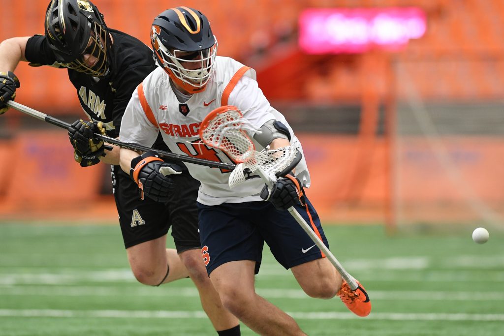 Army’s Kyle Beyer and Syracuse’s Brett Barlow fight for a loose ball during the game at the Carrier Dome on Feb. 23, 2020.