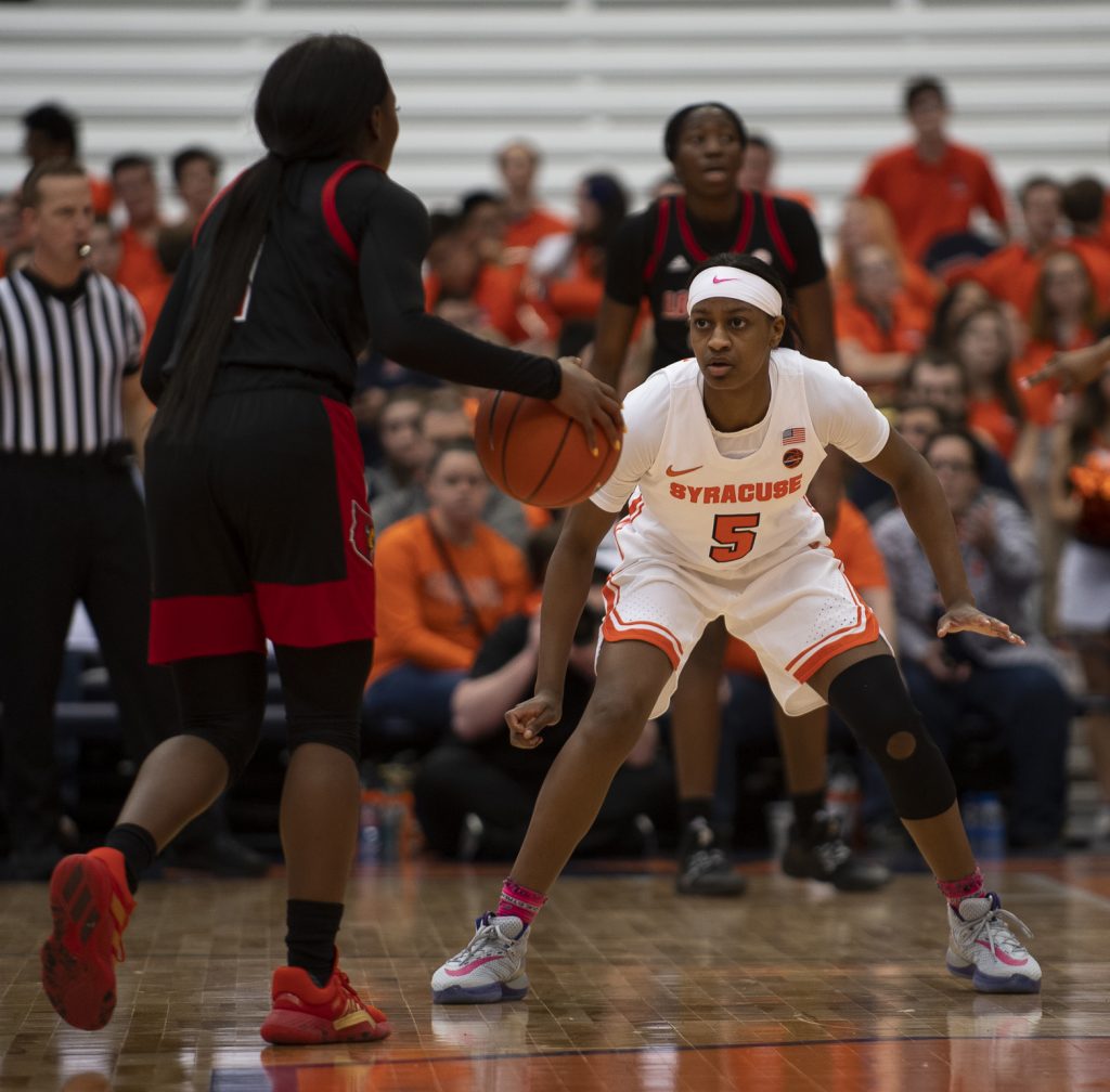 Guard Teisha Hyman guards Louisville's Dana Evans.