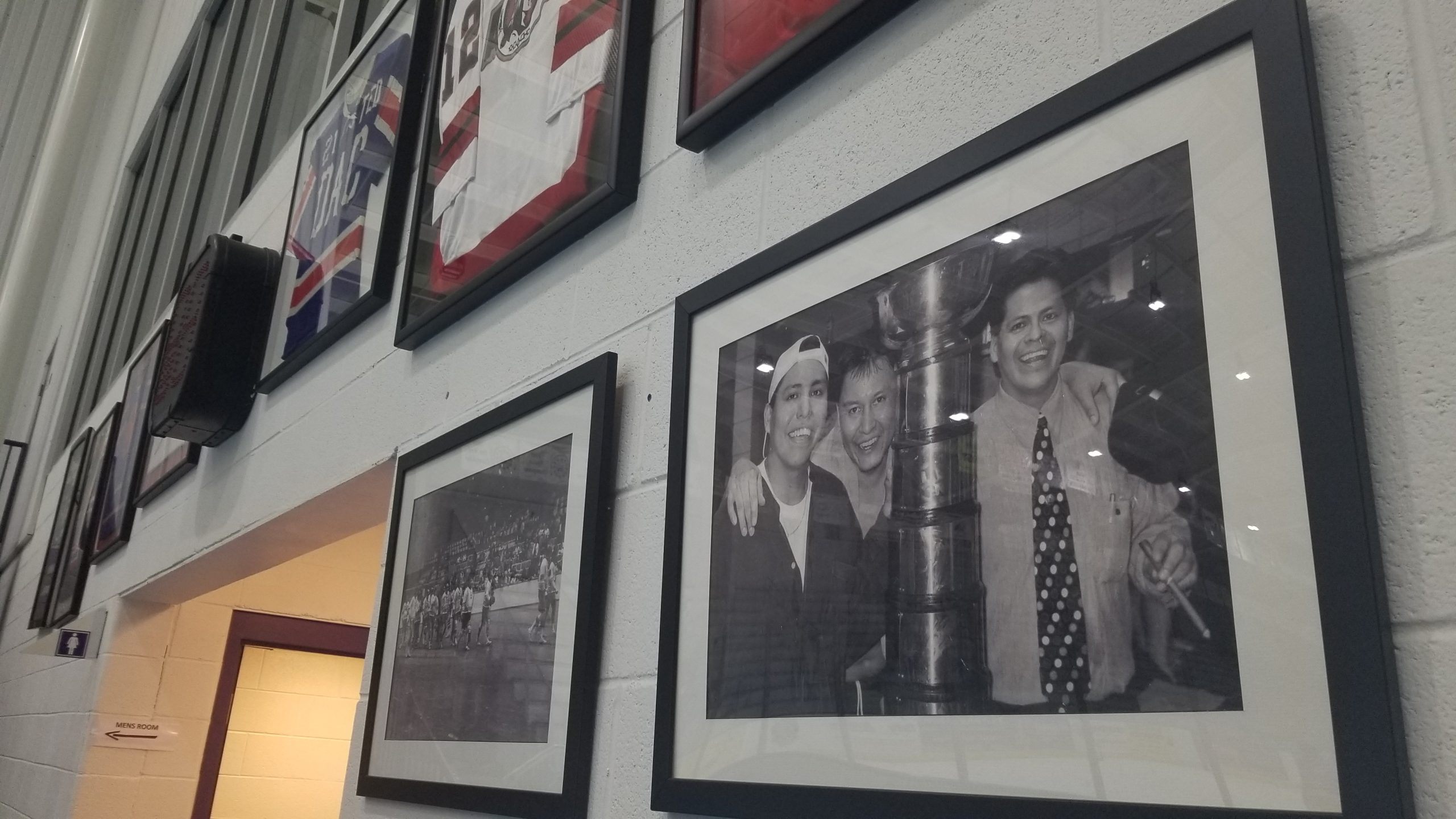 Powless, left, and his older brother and coach Barry Powless, right, with the World Championship trophy for the Rochester Knighthawks in 1997, Neal’s rookie year.