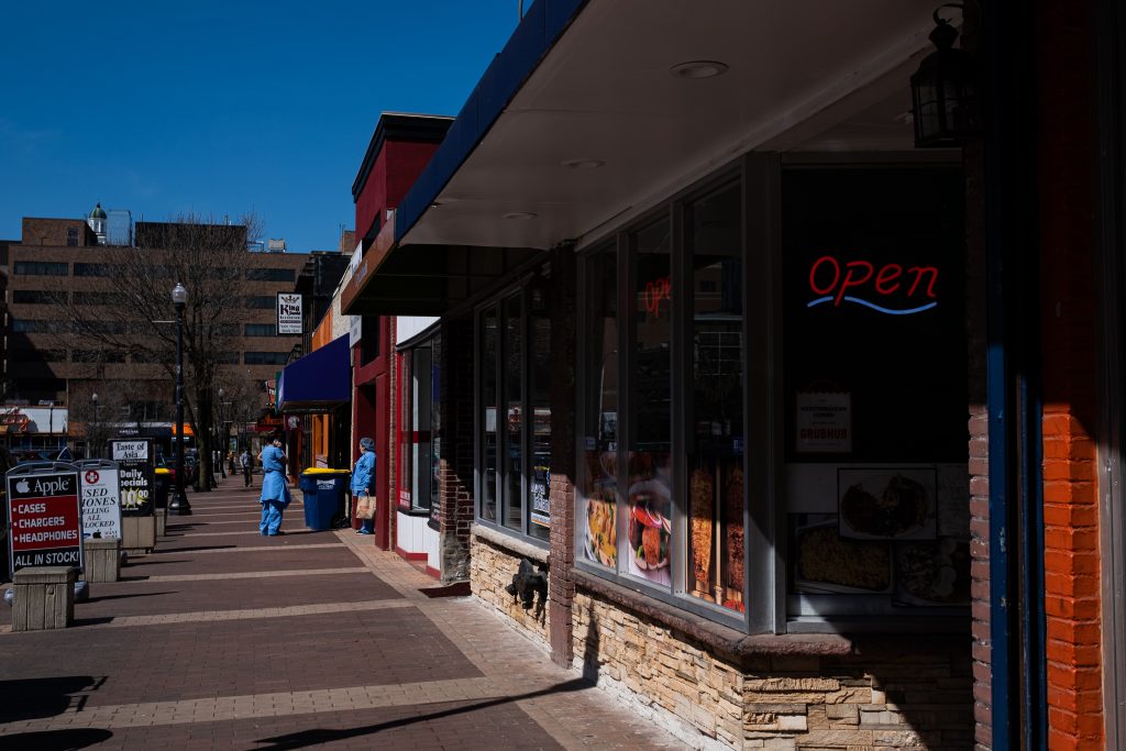 Marshall Street remains largely empty except for healthcare workers who work at the nearby hospitals during the coronavirus pandemic
