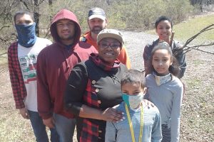 Samantha Pierce and her family pose for a photo.