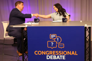 Incumbent Rep. John Mannion (New York-22) shakes hands with challenger Kailee Buller during their congressional debate at the Newhouse School of Public Communications studios on Oct. 5, 2026.