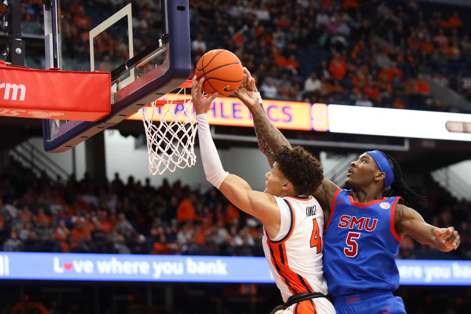 Nate Kingz makes a shot around Southern Methodist gaurd Jaron Pierre Jr. during Syracuse's game against SMU at the JMA Wireless Dome on Feb 14, 2026.