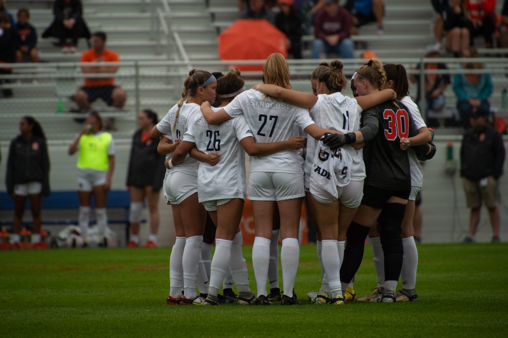The Syracuse Women’s Soccer team huddles before their match against Cornell University on September 11, 2022. Syracuse finished the game winning 3 to 0.
