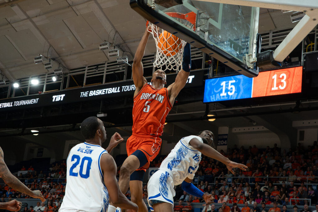 Boeheim's Army center Kaodirichi Akobundu-Ehiogu dunks on Hall In players during Thursday's first round game of The Basketball Tournament at the at the Upstate Medical Arena at War Memorial.