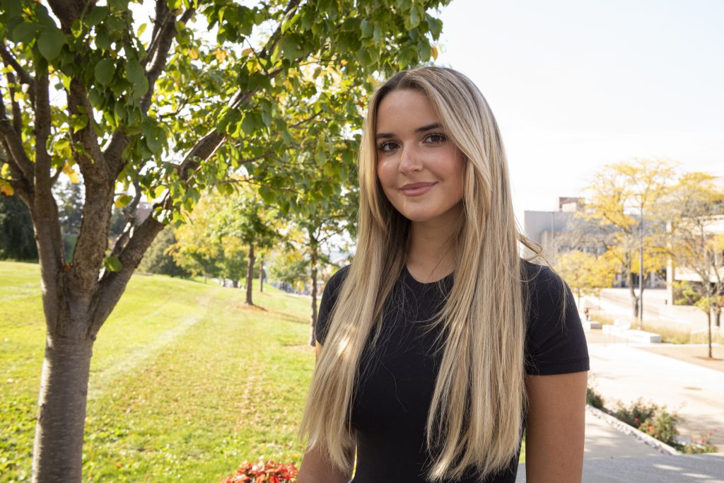 Kate Mehne poses outside at Syracuse University.