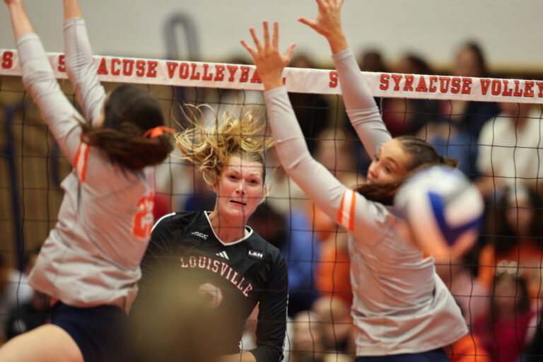 Louisville outside hitter Chloe Meester (3) watches the ball go through two Syracuse defenders during a college volleyball game between the Louisville Cardinals and the Syracuse Orange on September 25, 2026, in Syracuse, NY (Photo by Brody Shuffler/Newshouse)