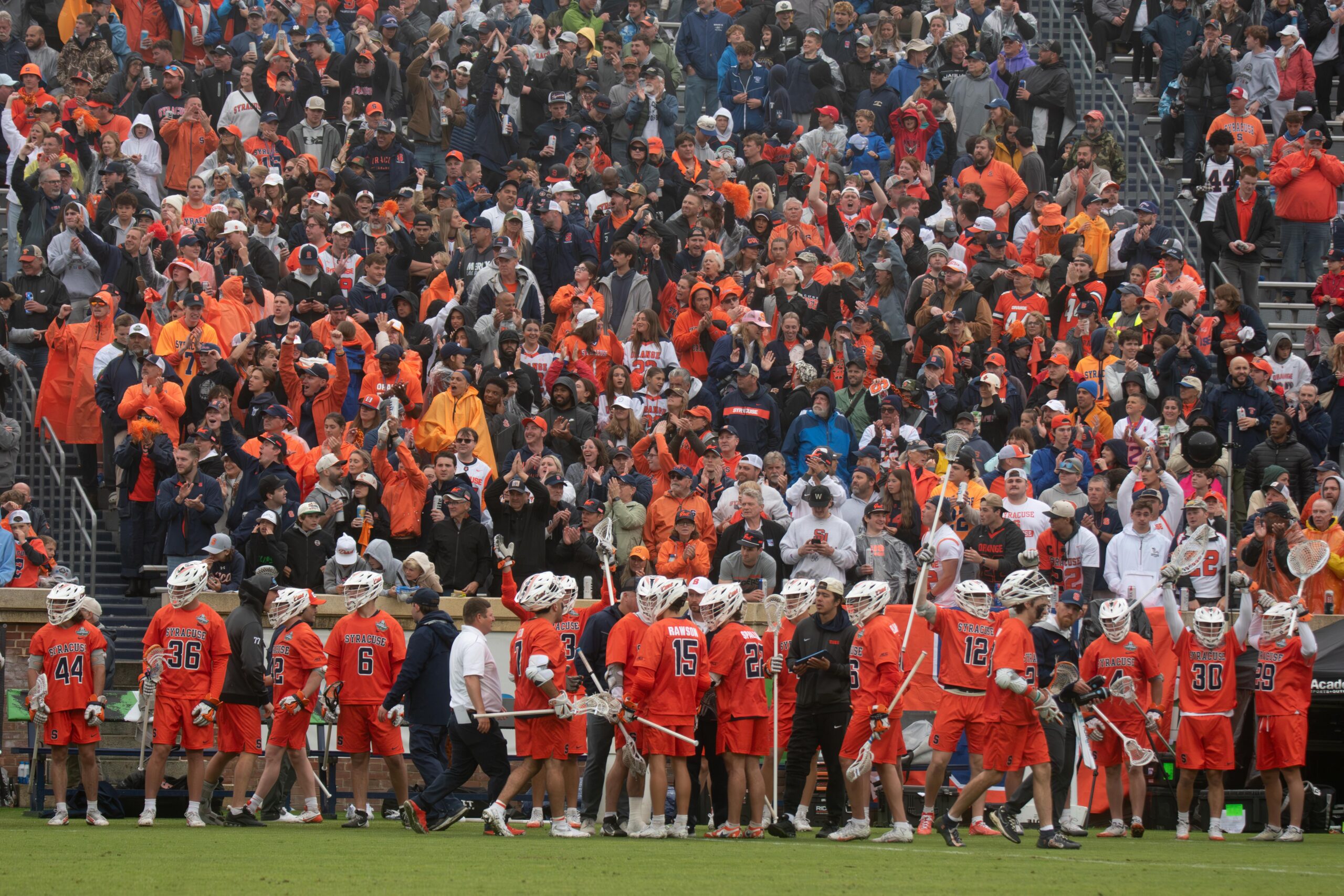The Syracuse fan section celebrates after a goal in the NCAA Semifinal against Notre Dame on May 23, 2026 at Scott Stadium in Charlottesville, Virginia.