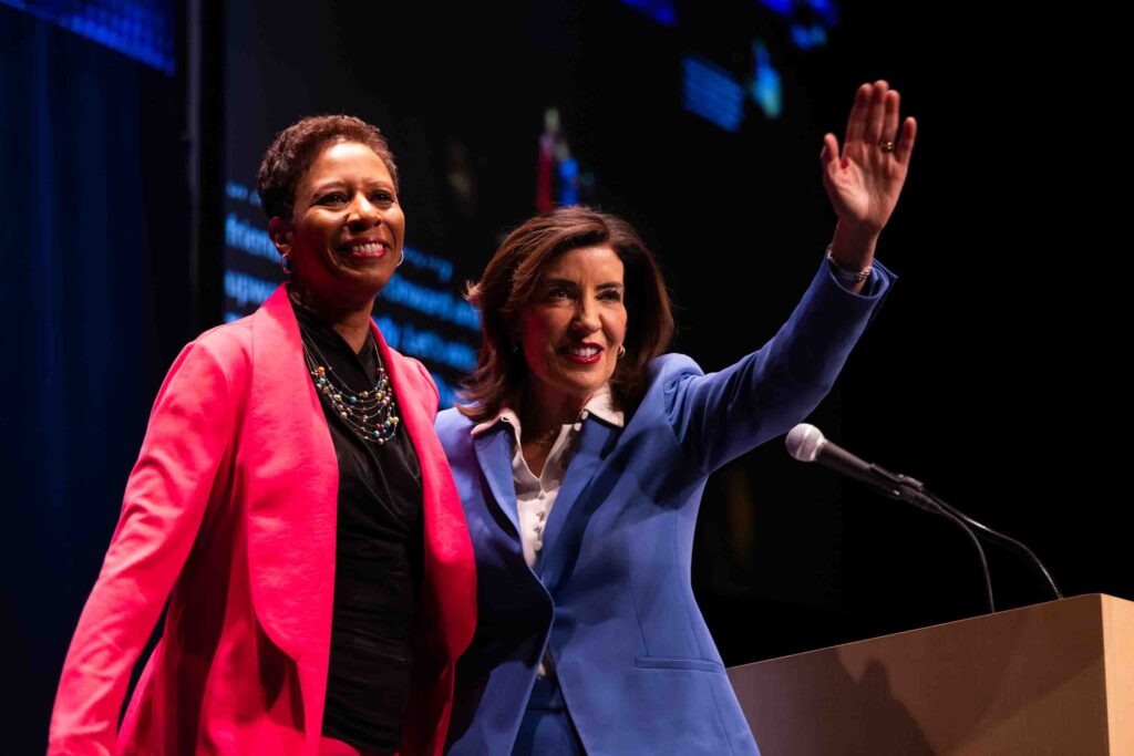 Running mate Adrienne Adams and New York state Governor Kathy Hochul celebrate on stage at the Carrier Theater during the Democratic Convention.