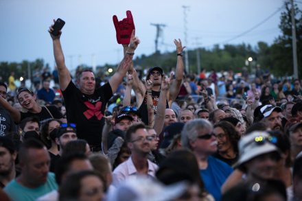 Fans stand up and cheer as they wait for Chevelle to take the stage.