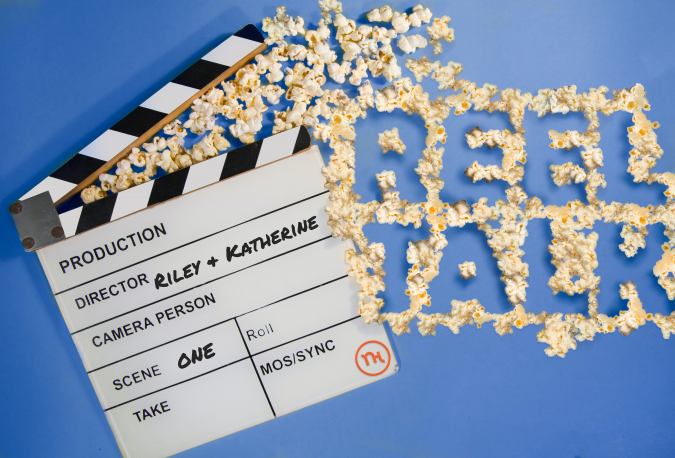 Popcorn spells out "Reel Talk" next to a film clapper.