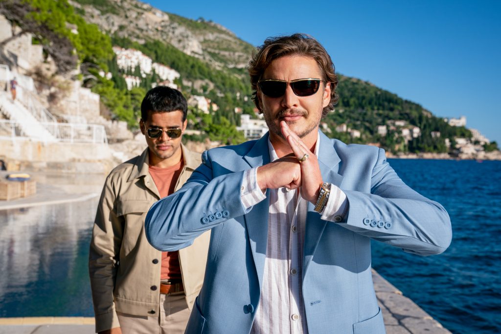 Javi Gutierrez (Pedro Pascal) greets Nick Cage with a