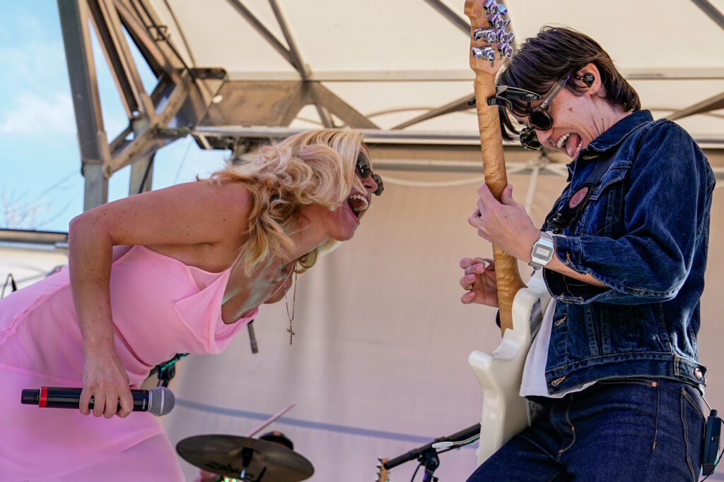 Ashe rocks out with a member of her band on the Syracuse Quad during Juice Jam on Saturday, September 20th.