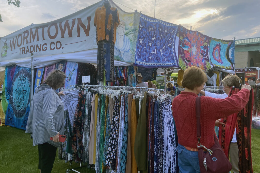 Music fans browse clothing racks on Friday, June 13, 2025, at the part of the New York State Blues Festival.