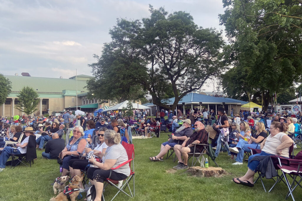 Music fans watch live acts on Friday, June 13, 2025, on the New York State Fairground Chevy Court stage as part of the New York State Blues Festival.