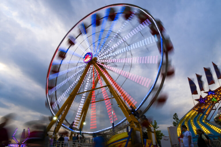 Attendees ride the carousel at sunset inside the New York State Fair on Aug. 24, 2025. (Photo by Troy Conner)