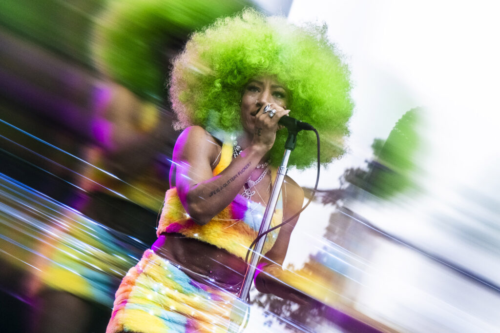 A backup vocalist for George Clinton and the Parliament Funkadelic at the New York State Fair sings at the Chevy Court Stage on Aug, 20, 2025. (This image was created using a Prism FX lens filter.) (Photo by Troy Conner)