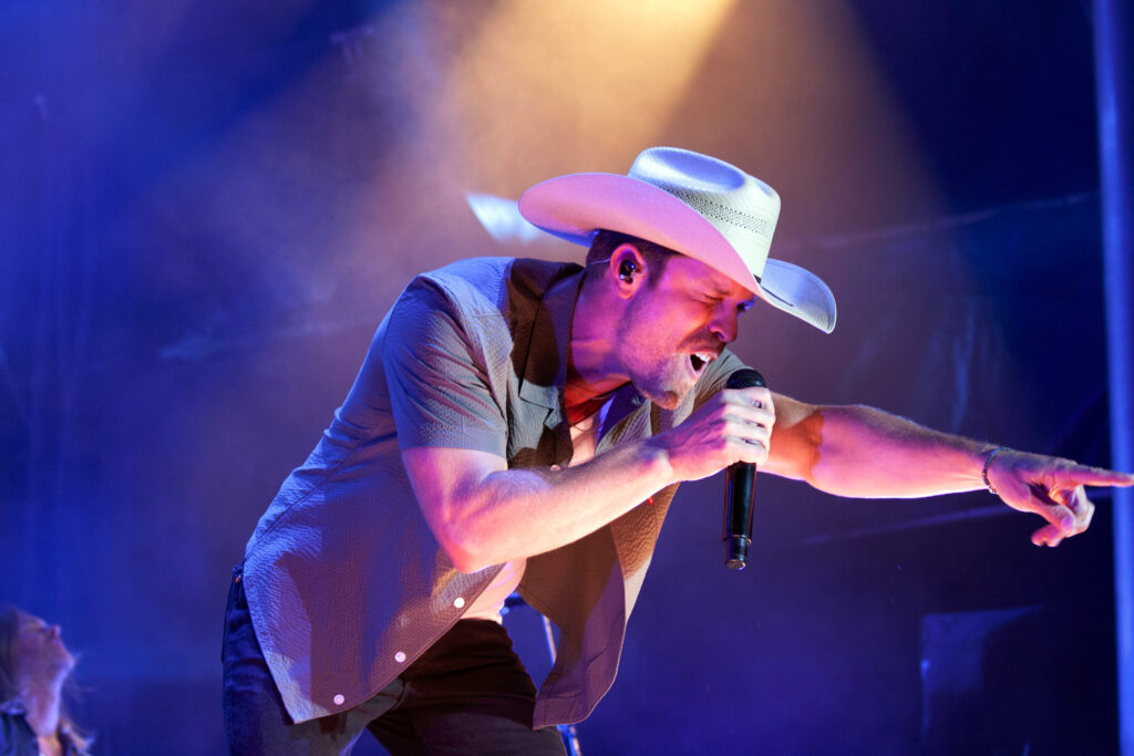 Dustin Lynch points at the audience on the Surburban Park stage at the New York State Fair on Friday.