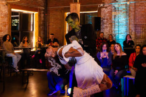 MAZE Studios models Aryana Josephs and Gavin Schiavi put on a Frankenstein-inspired performance at Glam Slam on October 2, 2025. The Syracuse Fashion Week event, held at Middles Ages Brewing Co., entertained guests through a fashionable content of local artists.
