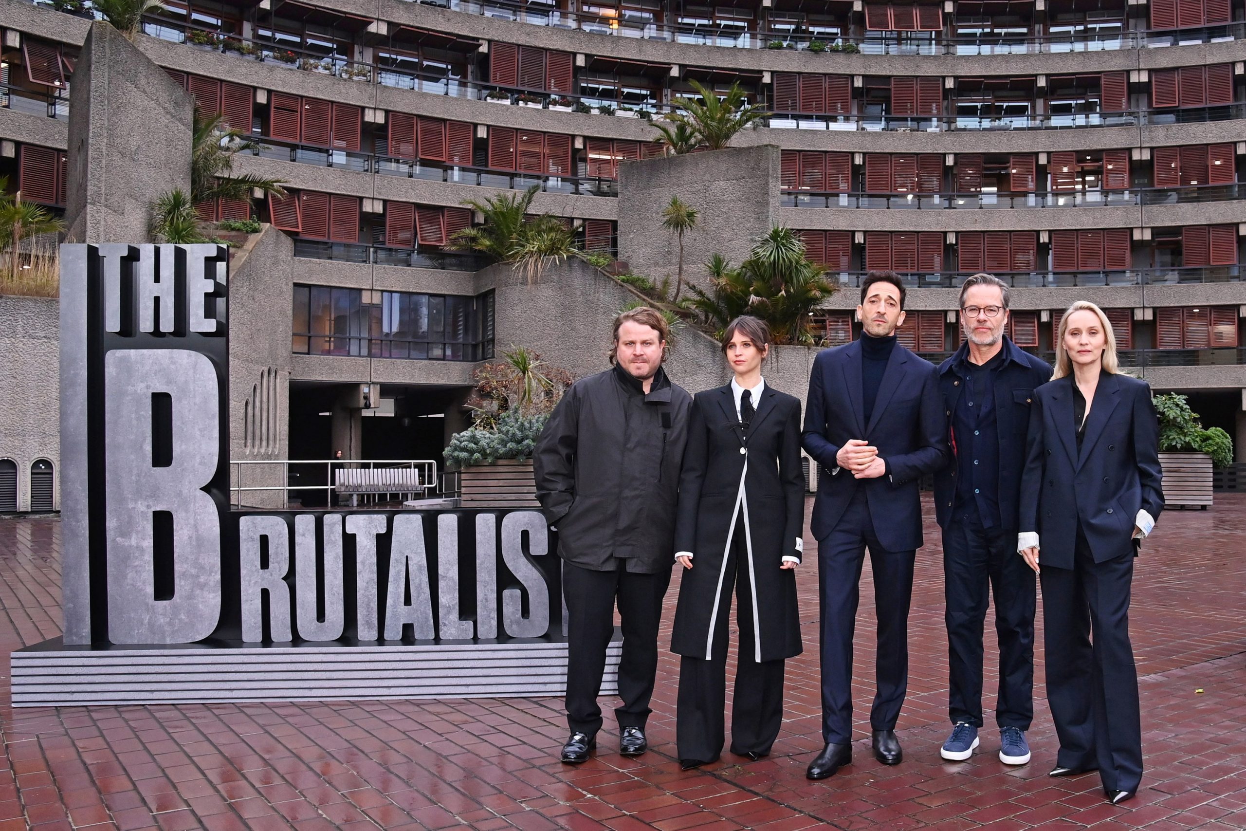 Brady Corbet, Felicity Jones, Adrien Brody, Guy Pearce and Mona Fastvold attend the London photocall for "The Brutalist" at Brutalist landmark The Barbican on January 15, 2025 in London, England.