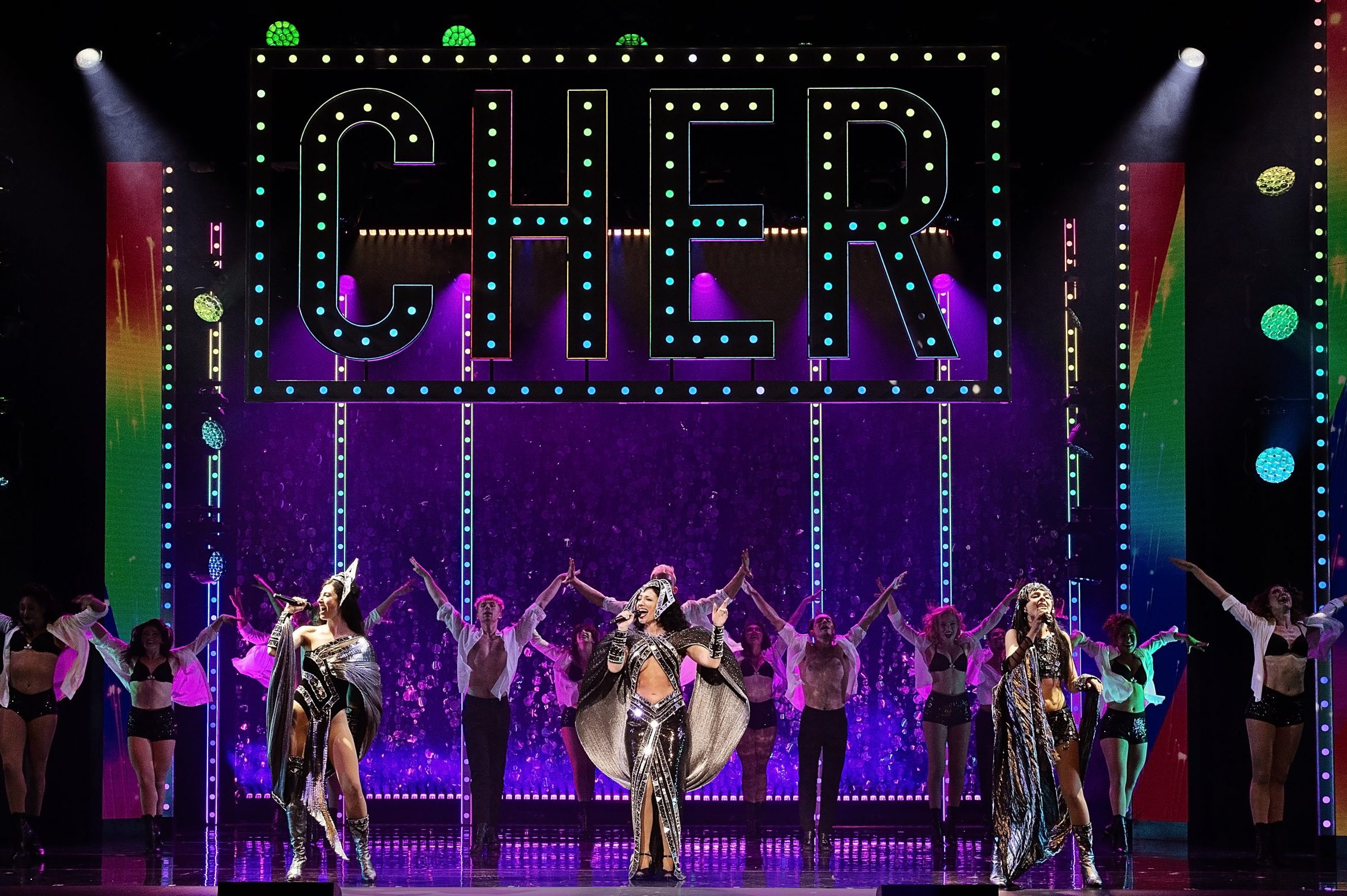 Catherine Ariale as Lady (far left), Morgan Scott as Star (center) and Ella Perez as Babe (far right) depict different eras of Cher's career.