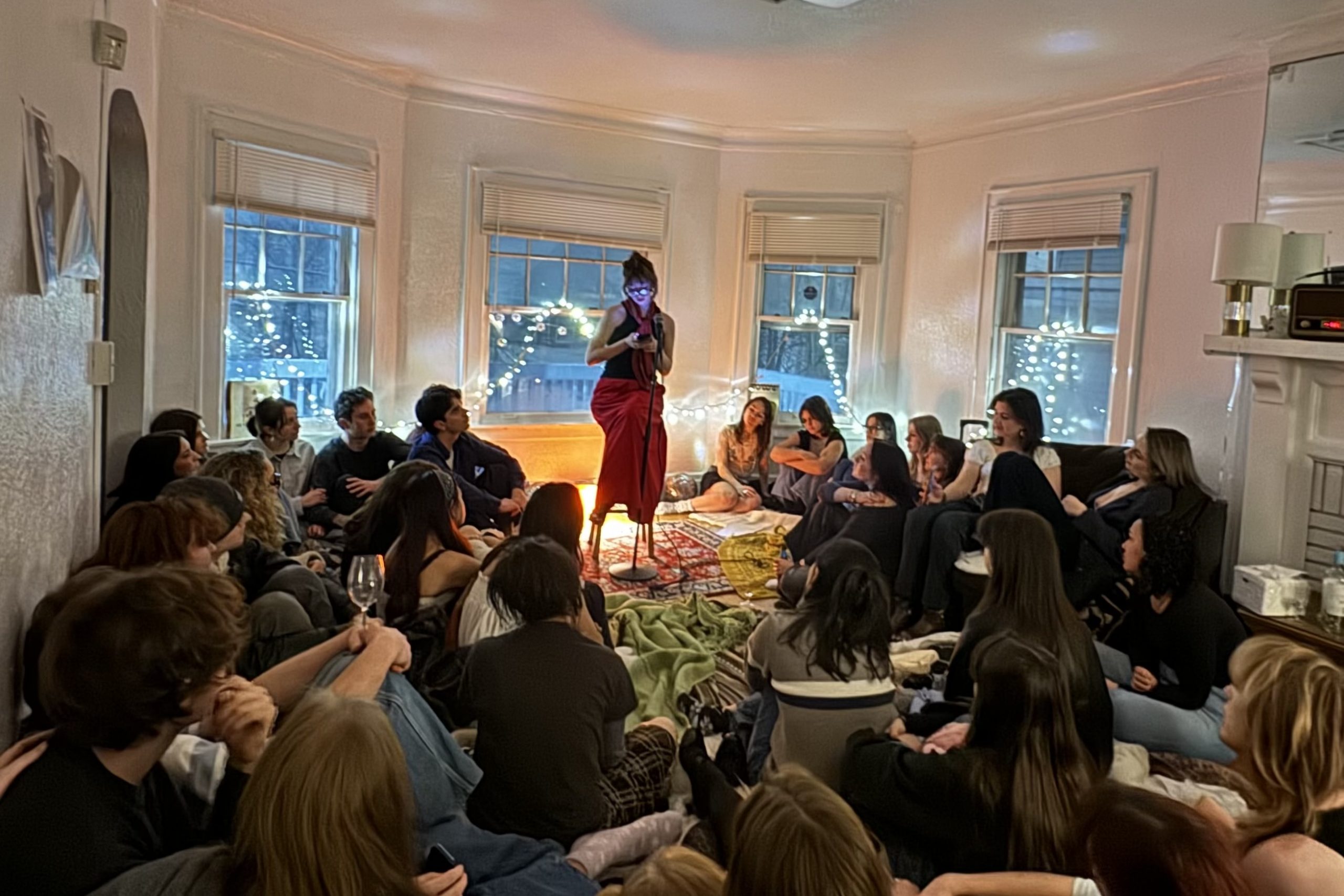 Audrey Weisburd reads an original poem at The Salon poetry event on Feb. 8, 2025, at a home on Comstack Avenue in Syracuse, New York.