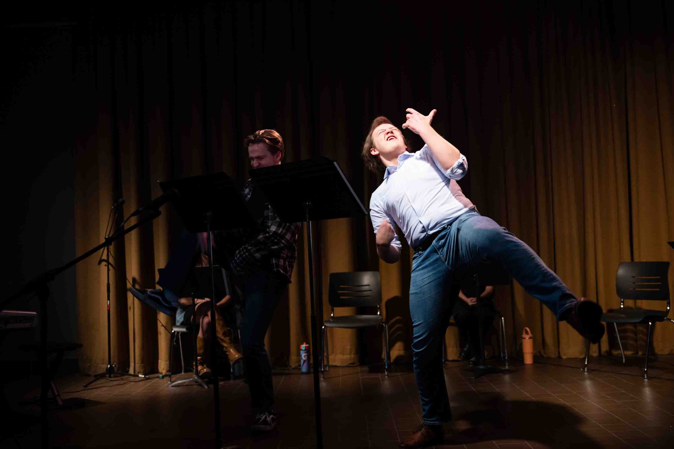 From left to right, Reed Grayner and Robbie Moseley dance as their characters Jon and Michael respectively during 