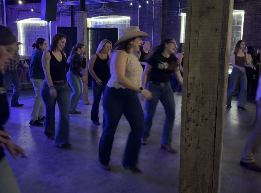 Fahrenz dances and laughs with a friend