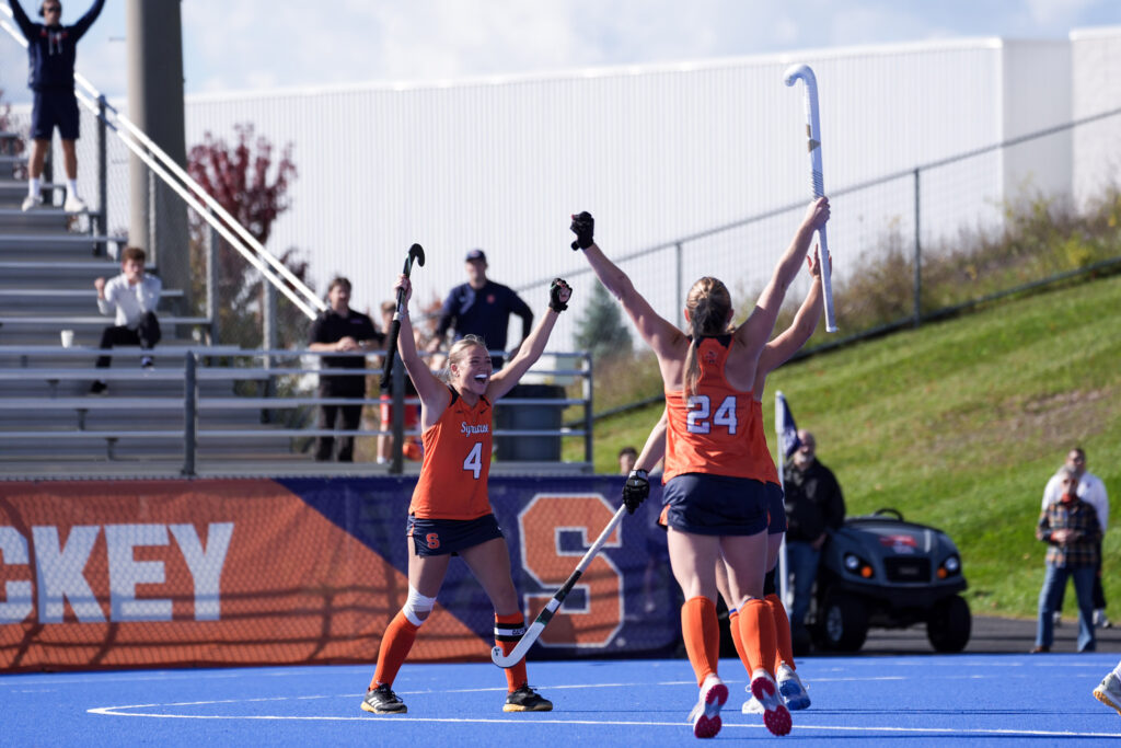 Syracuse forward Hattie Madden and midfielder Ava brewer celebrate the goal by defender Jess Liddell against Louisville on Friday, October 9, 2026, at the J.S Coyne Stadium.