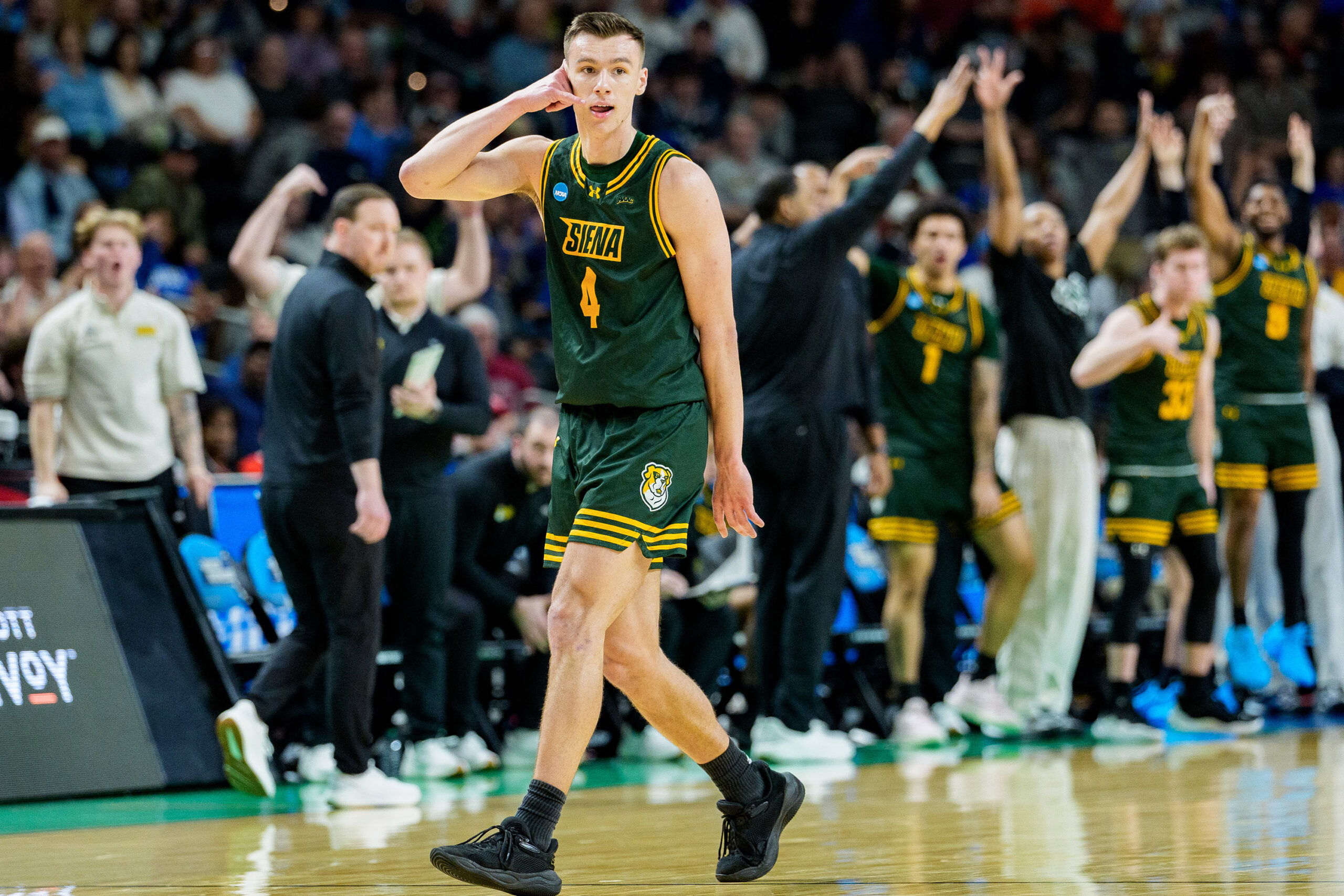 Gavin Doty #4 of the Siena Saints reacts in the first half against the Duke Blue Devils during the first round of the NCAA men's basketball tournament at Bon Secours Wellness Arena on March 19, 2026 in Greenville, South Carolina.