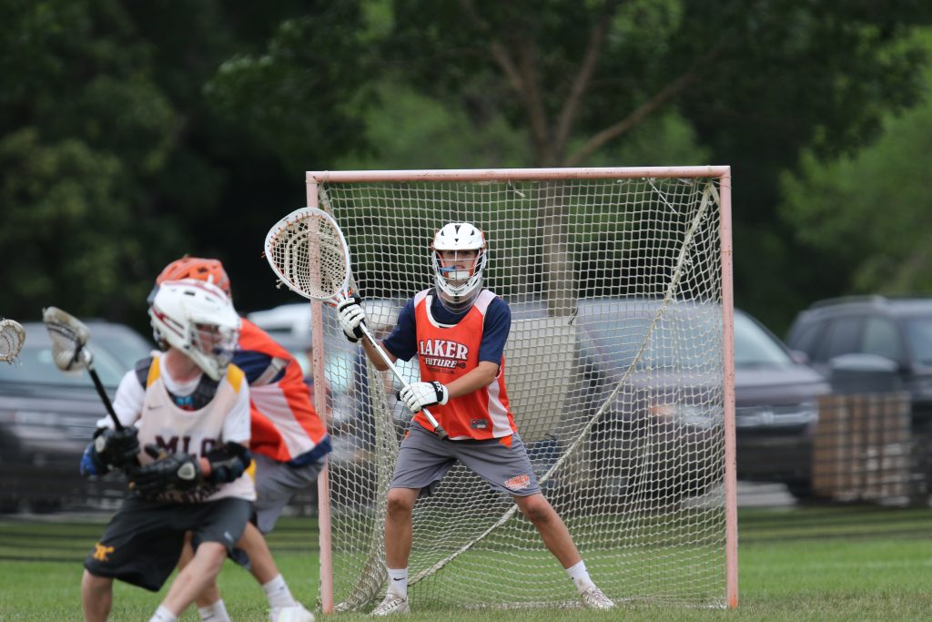 Harrison Thompson stands in goal.
