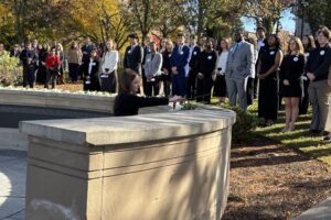 Remembrance Scholars, Lockerbie Academy students and teachers, and university leaders lay roses at the Wall of Remembrance on Friday, Oct. 23, during Remembrance Week for Pan Am Flight 103. Photo by Brian Koefoot.