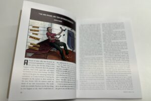 The inside of a magazine is shown with text and a cartoon image.