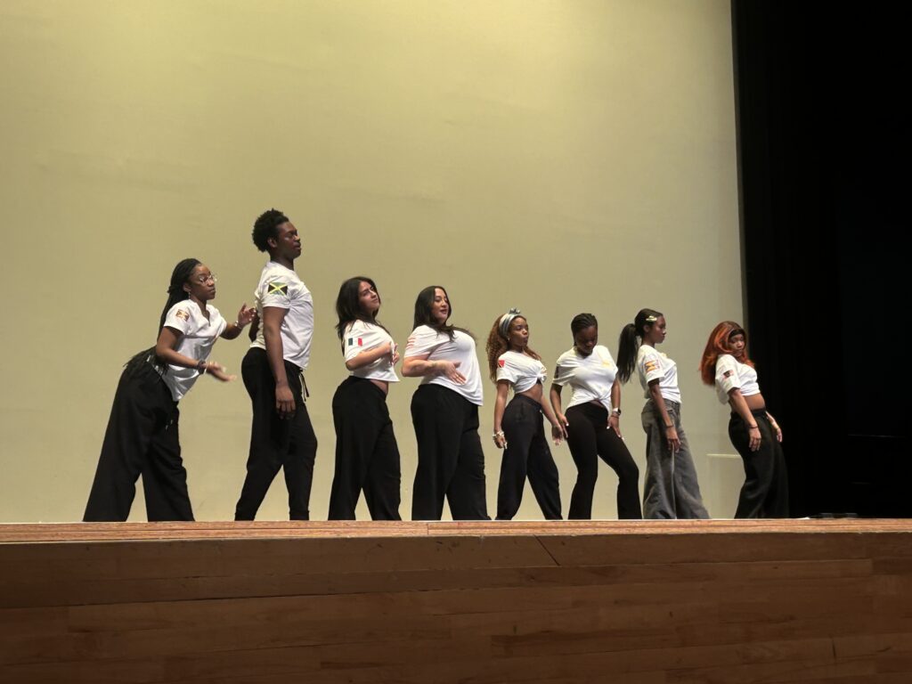 Kalabash Dance Troupe performs to a mix of cultural music at a Women's  History Month celebration on the SU campus Friday. 
