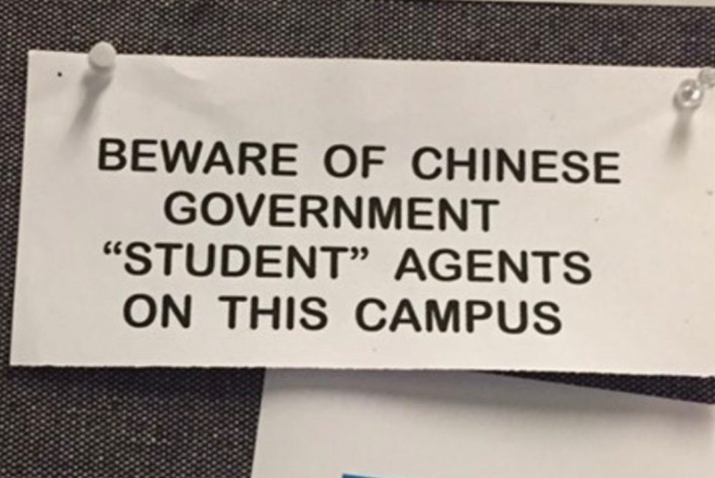 A note on a bulletin board reads