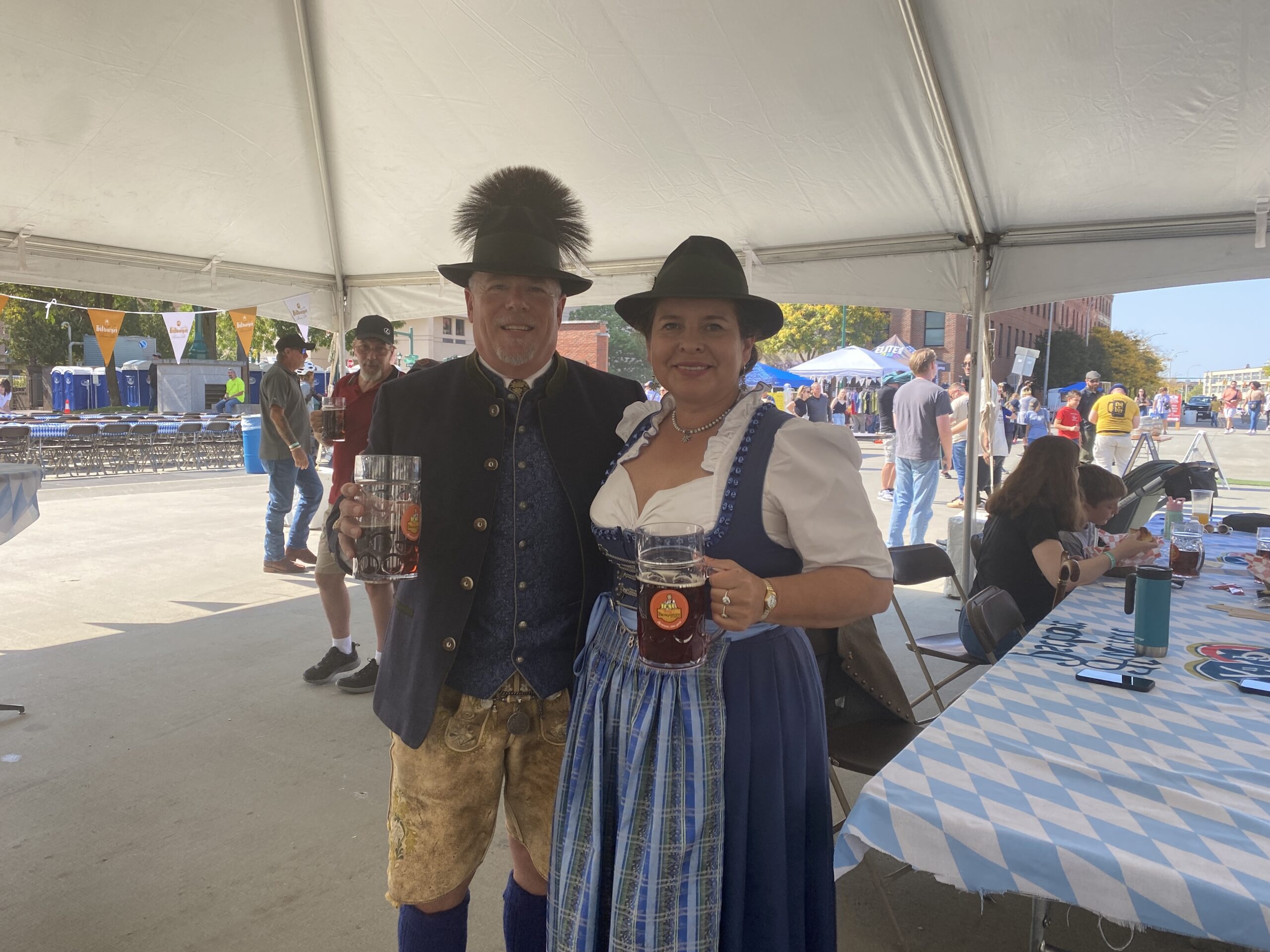 Two regulars at Oktoberfests enjoyed their souvenir liter cups of authentic German beer at the festival.