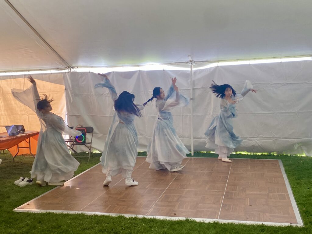 Students dance during