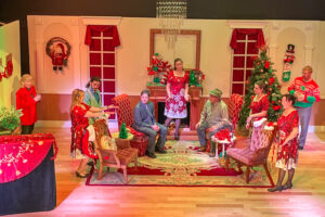 actors on stage at a play with a christmas set