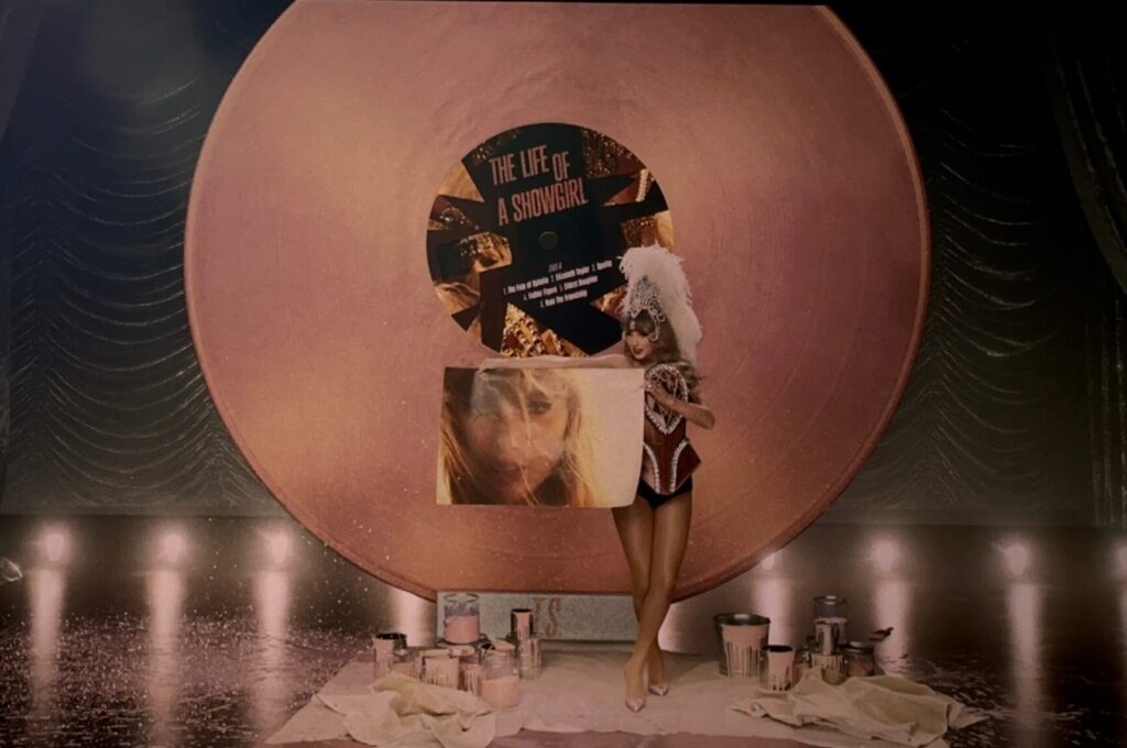 Taylor Swift movie with her dressed like a showman in front of a giant record