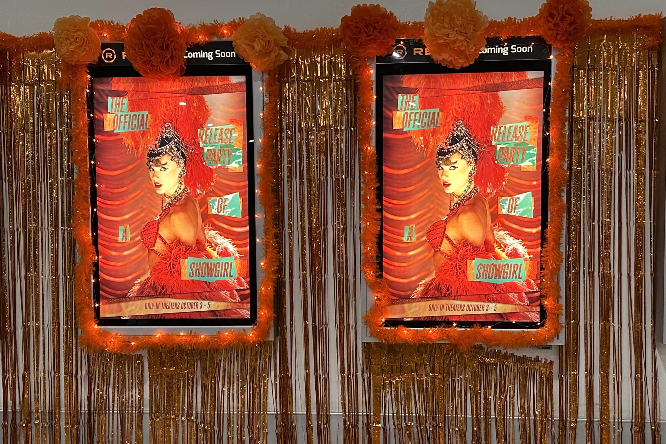 Movie poster for taylor swift's "Official Release Party of a Showgirl" decorated with orange streamers and pom poms