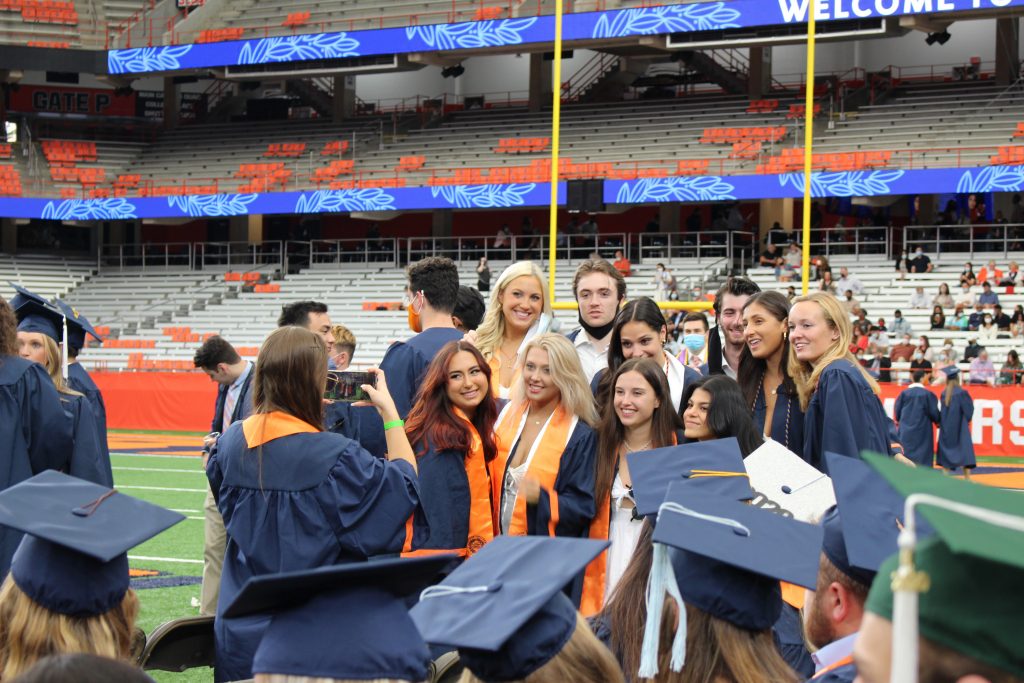 2020 SU graduates pose before the September 19, 2021 Commencement ceremony in the Dome on September 19th, 2021.