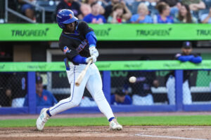 Outfielder D’Andre Smith makes contact with the ball.