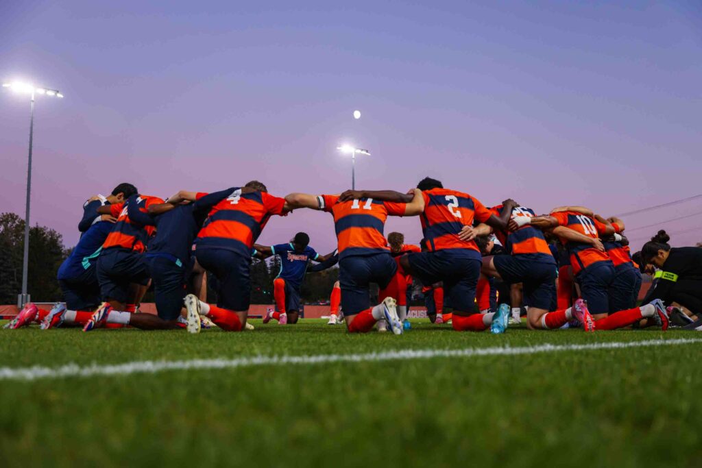 The Syracuse University Men's Soccer team faced off against Boston College on Friday, October, 3, 2025. The team came together before the game in prayer.